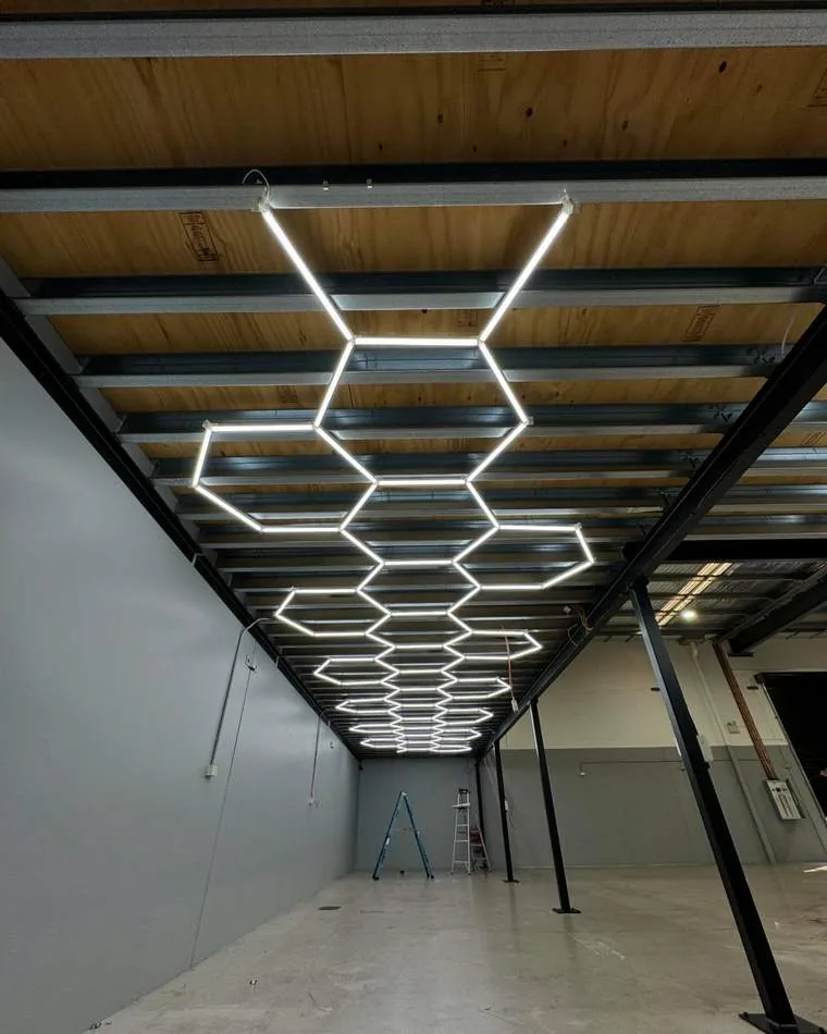 Large workshop with hexagonal LED lighting installation